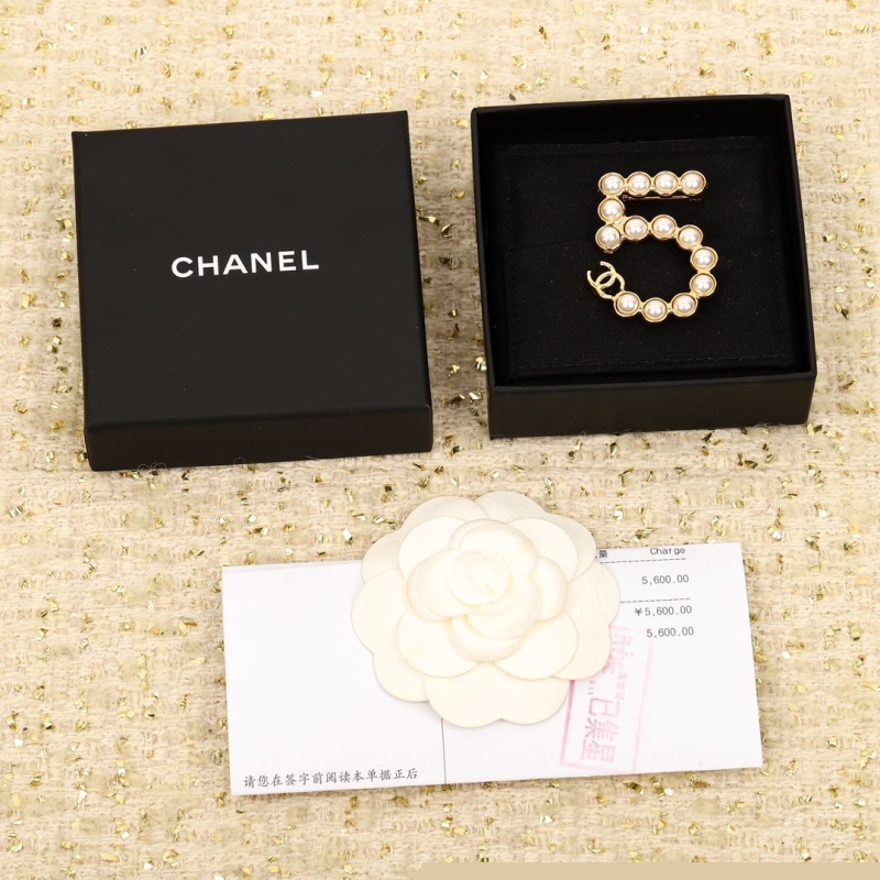 Ch*el brooches